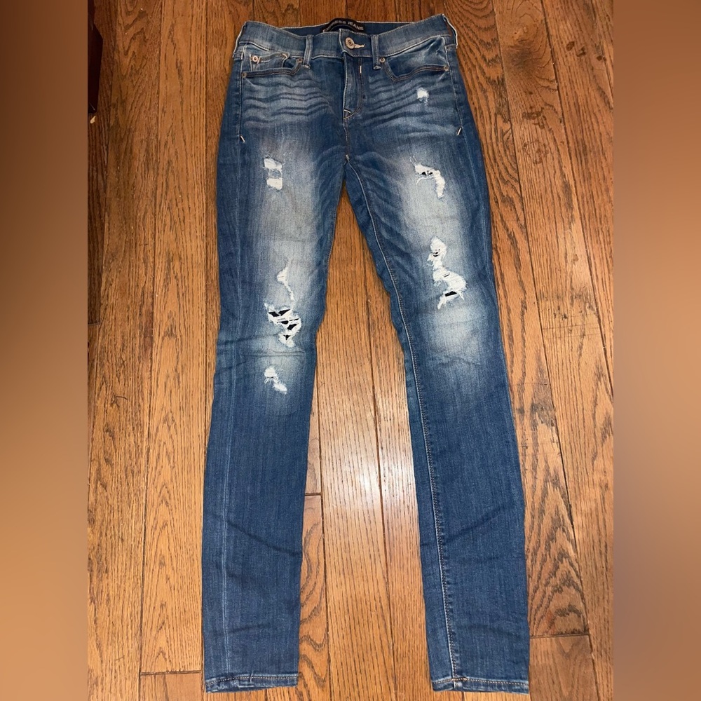 Express Jeans. Distressed. Size 2. Patches behind the holes for warmth.